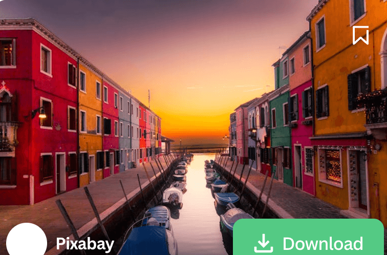 Colorful Venice canal with traditional buildings and gondola at sunset